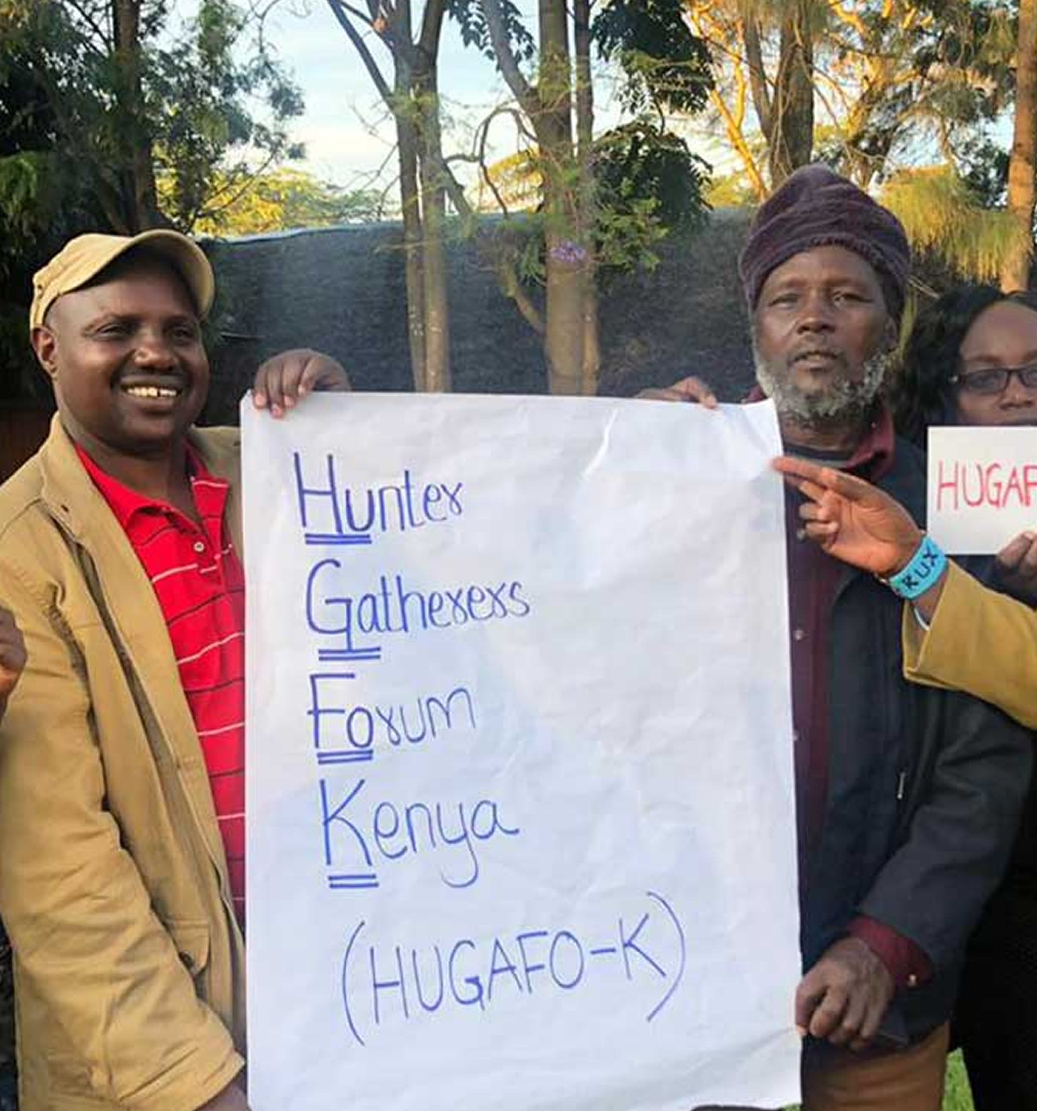 HUGAFO-K community members with forum sign